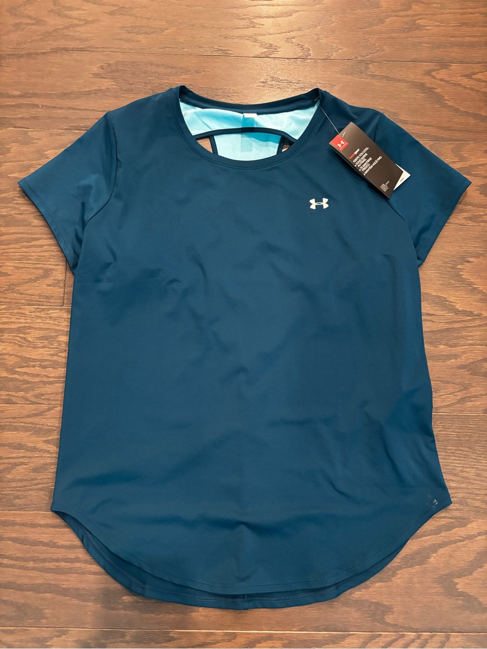 New - Under Armour women’s shirt vent back, size medium